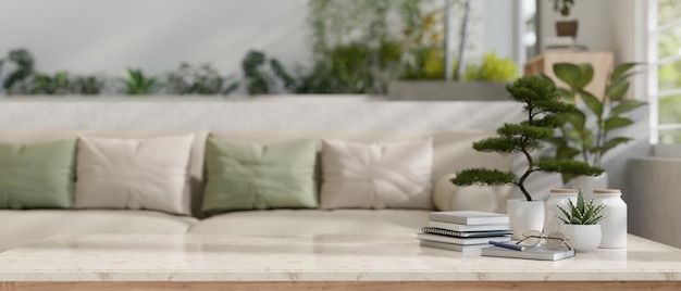 Copy space on a marble tabletop with a blurred modern cozy living room with a comfortable couch