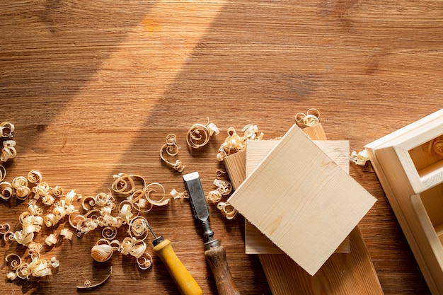 Copy space with tools and wood sawdust in workshop