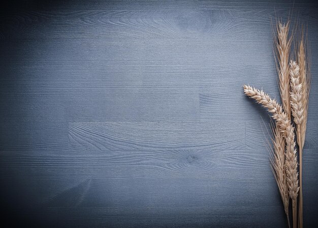 Copyspace image ears of wheat on wooden board