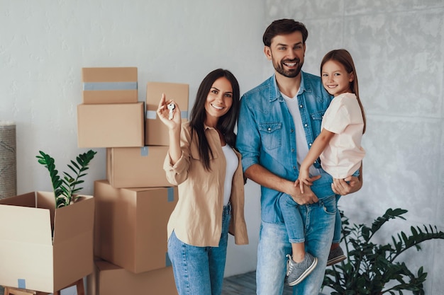 Copyspace photo of an adorable young couple and their daughter having moved into a cozy new appartment