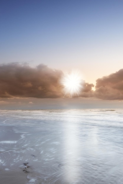 Copyspace at sea with cloudy twilight sky background above the horizon at sunset Calm ocean waters at a beach in Torrey Pines San Diego California Majestic scenic landscape for relaxing getaways