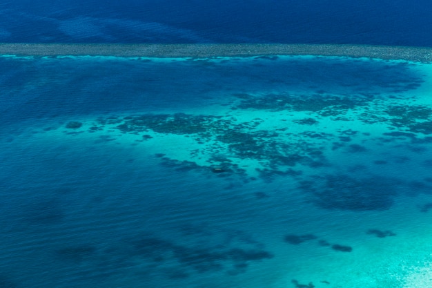 Coral reef and detail of atoll in indian ocean maldives view from seaplane window
