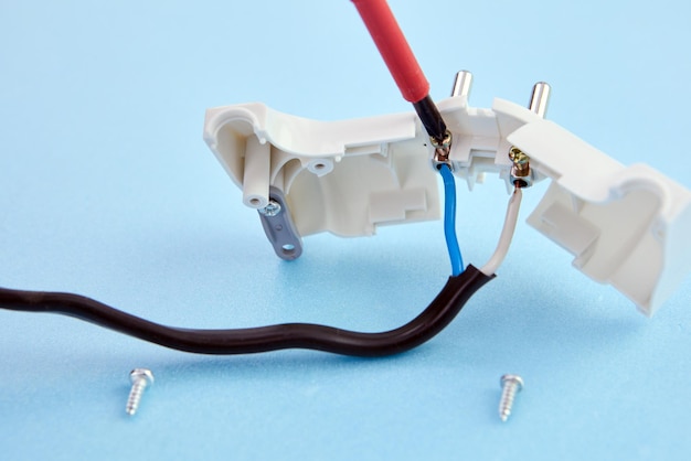 Cord is connected to folding electric plug and secured with fixing bolt