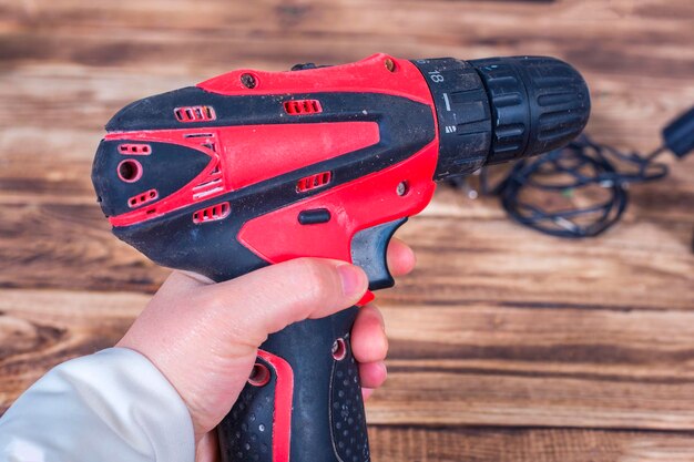 Cordless or driller in a man hand