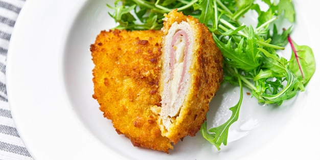 cordon bleu cutlet chicken meat, cheese, bacon meal snack on the table copy space food background