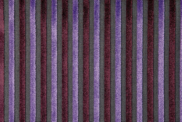 Corduroy background with lines pattern close up Texture of violet corduroy textile useful as background Canvas vertical line texture