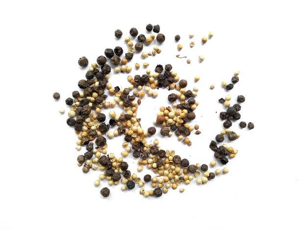 Coriander seeds and Black pepper on white background