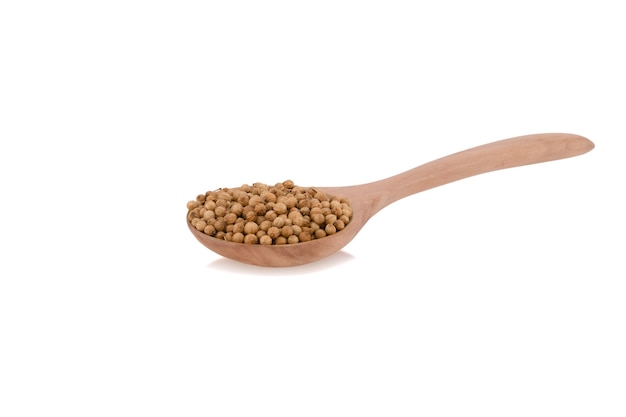 Coriander seeds in wood spoon