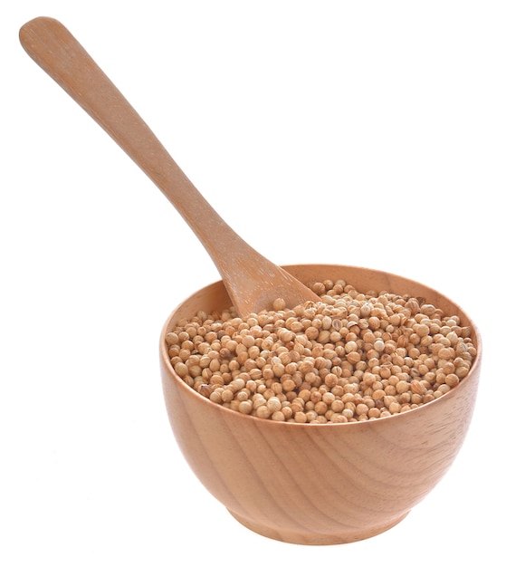 Coriander seeds in a wooden bowl