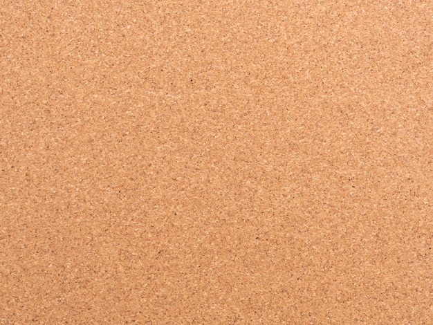 Corkboard background. Brown paper texture. Abstract pattern. Wood backdrop. Cardboard wall. Plywood. Cork texture