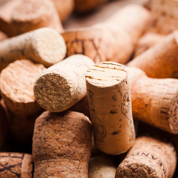 Corks on the wooden table. Wine and alcohol concept