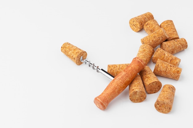 corkscrew and wine cork isolated on white background