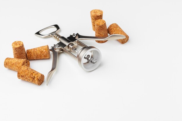 corkscrew and wine cork isolated on white background