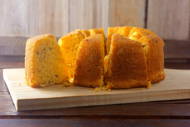 Corn cake sliced on wooden board