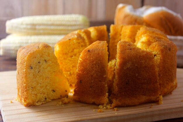 Corn cake sliced on wooden board