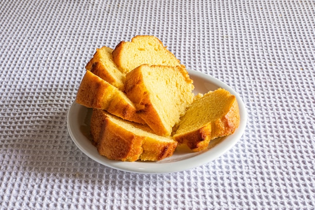 Corn cake with cornmeal on breakfast table.