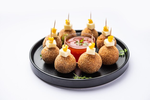 Photo corn cheese balls with dip popular party snack from india