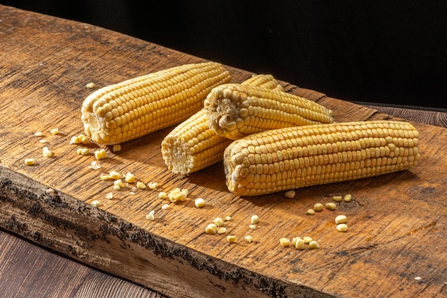 Corn on the cob on rustic wooden background