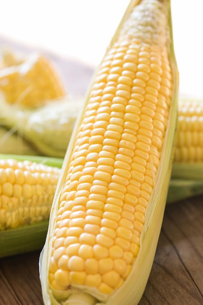 Corn on the cob Sweet corn for cooking food Fresh corn on wooden background Harvest ripe corn organic