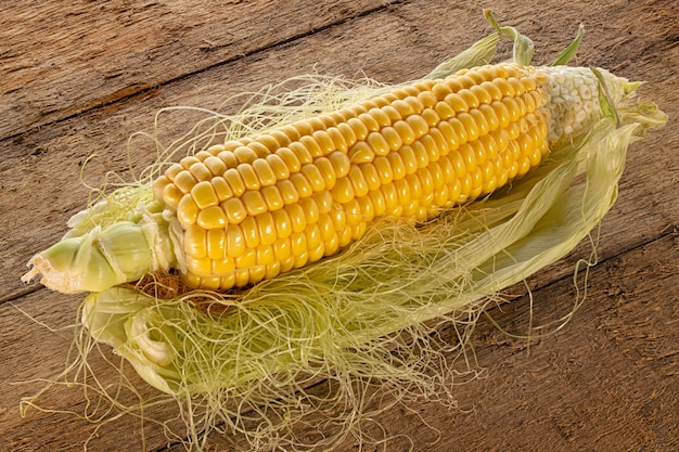 Corn Cob on The Wooden Table close up