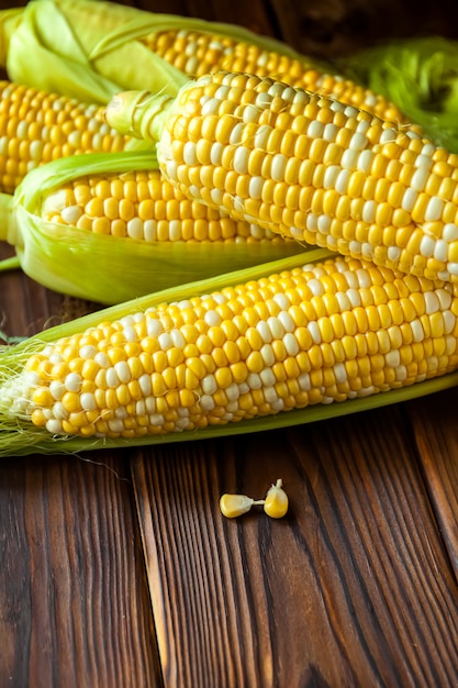 Corn cobs on rustic wooden table