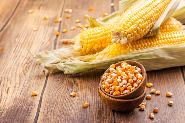 Corn cobs on wooden table