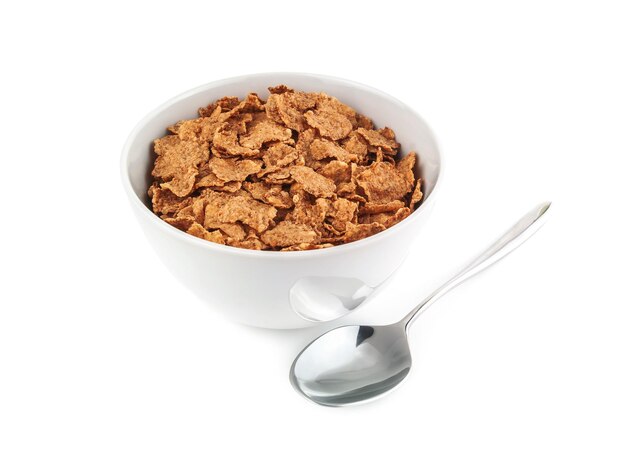 Corn flakes in bowl with spoon on white background