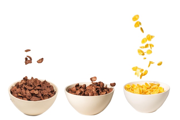 Corn flakes falling to the white bowl Motion Copyspace Isolated on white