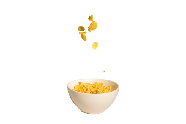 Corn flakes falling to the white bowl Motion Copyspace Isolated on white