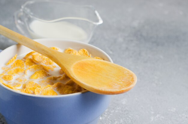 Corn flakes in milk in a bowl