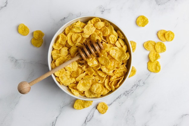 Corn flakes in white bowl