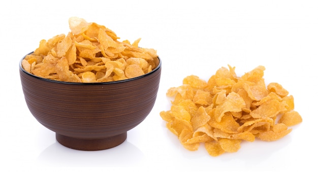 Corn flakes with milk isolated on white