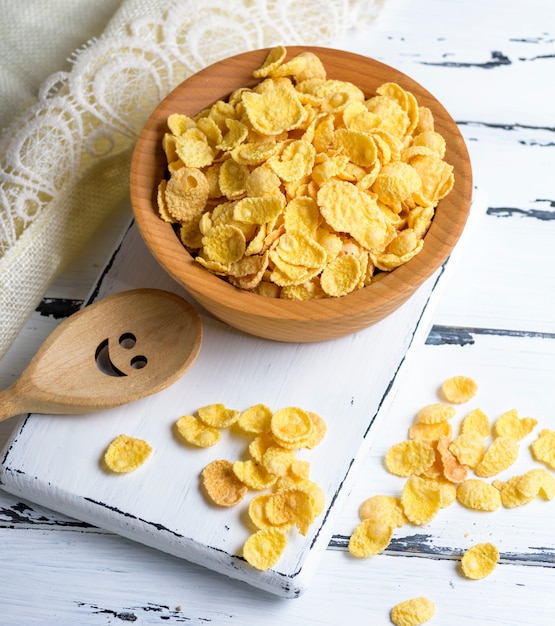 Corn flakes in a wooden bowl 