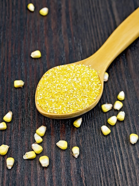 Corn grits in spoon on board