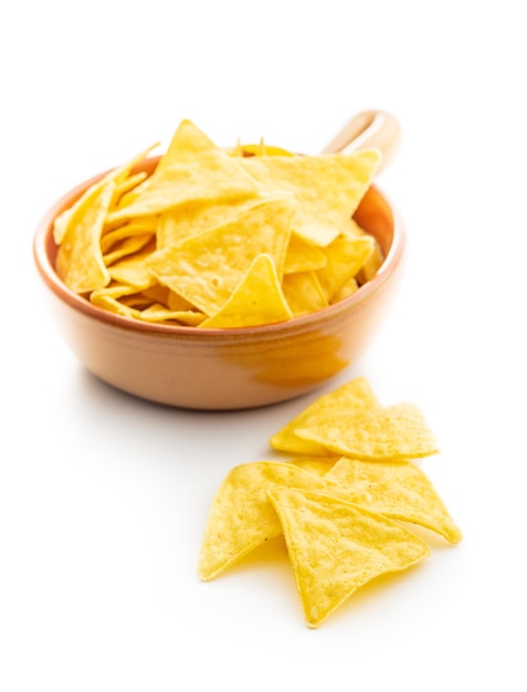 Corn nacho chips Yellow tortilla chips in bowl isolated on white background