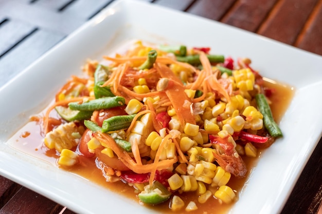 Corn seeds with fruits and vegetables sour spicy in plate