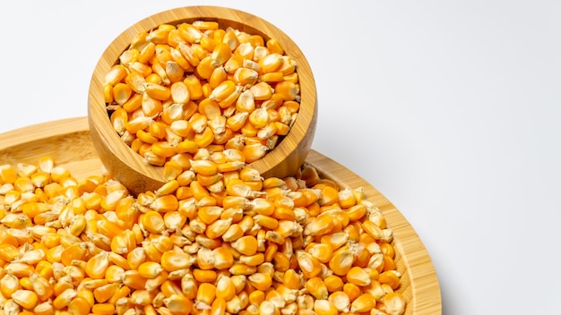 Corn seeds on a wooden bowl