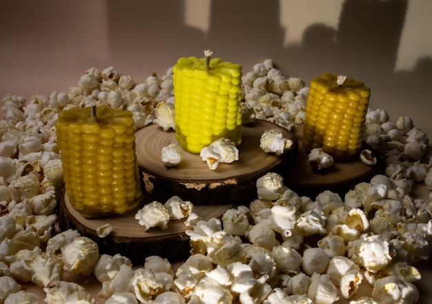 Corn-shaped candles among popcorn