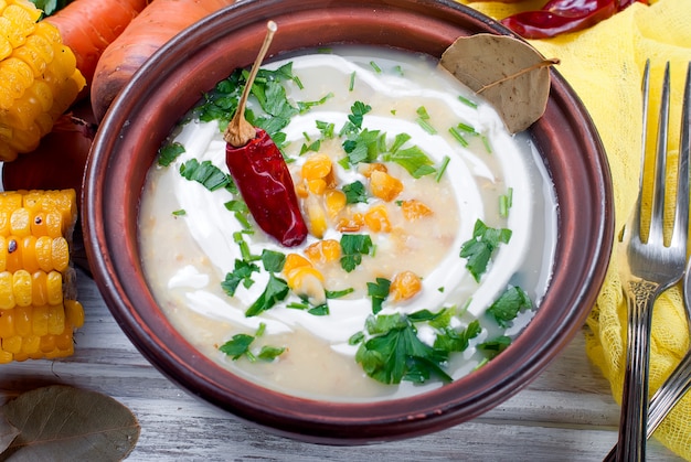 Corn Soup in a Ceramic Plate and Ingredients