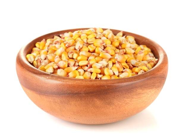 Corn in wooden bowl isolated on white