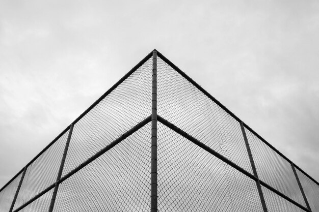 Corner of cage metal wire at tennis court