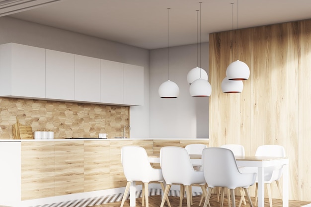 Corner of a light wooden kitchen interior with white walls and wooden floor. Dining table with white chairs and countertops. 3d rendering mock up