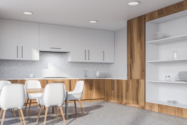 Corner of modern kitchen with white and concrete walls, concrete floor, wooden countertops, white cupboards and long table with chairs. 3d rendering