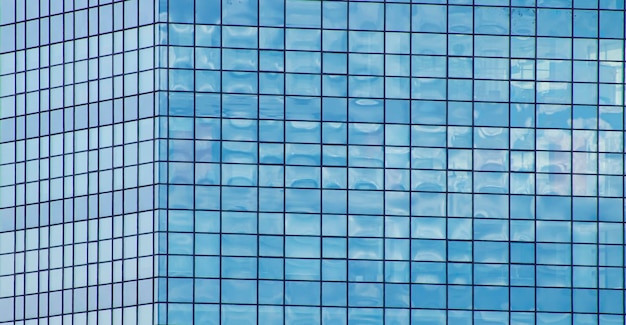 Corner of an office building made of mirrored glass windows