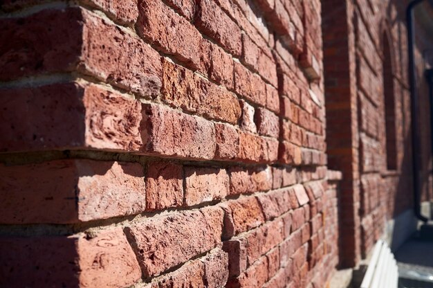 The corner of the old red brick building, on a sunny spring day.