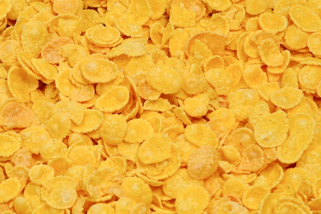 Foto cornflakes achtergrond en textuur bovenaanzicht cornflake cornflakes doos voor ochtendontbijt