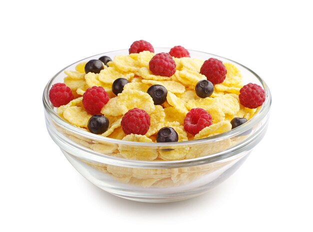 Cornflakes and berry in the transparent cup on a white background