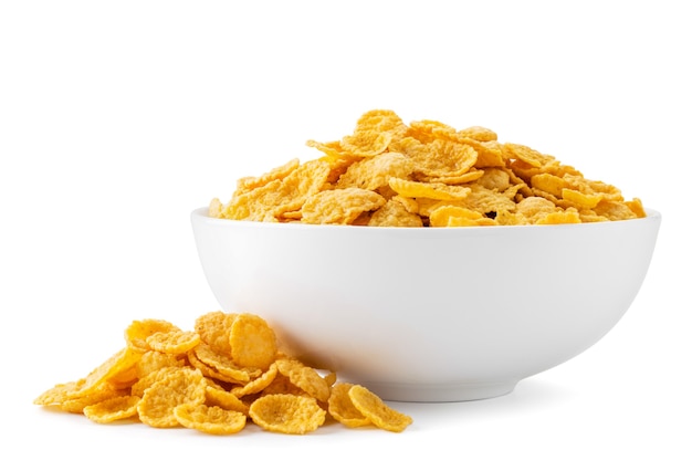 Cornflakes in een bord en verspreid geïsoleerd