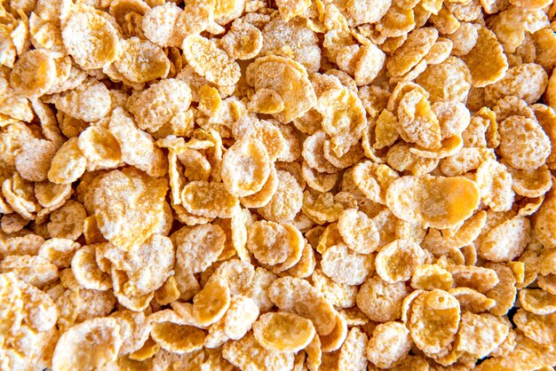 Cornflakes texture background, top view.