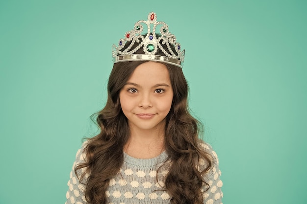 Corona means crown Lady little princess Dreams come true Kid wear crown symbol of princess Girl cute baby wear crown blue background Small princess concept Every girl dreaming to be princess